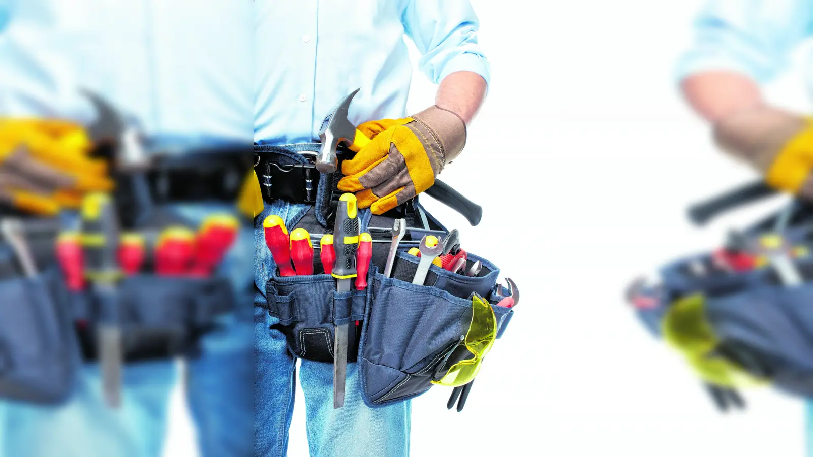 Worker with a tool belt. Isolated over white background. (Foto: mk)